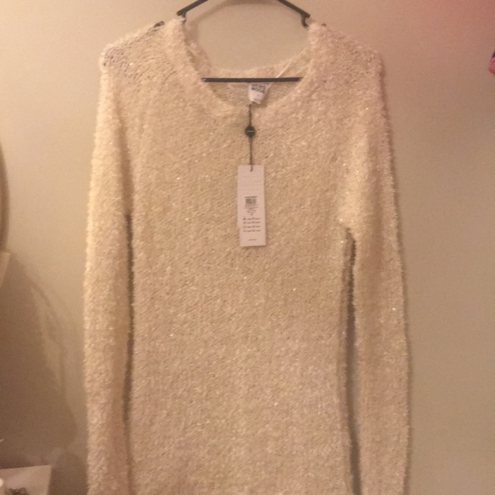 White sweater with tags
